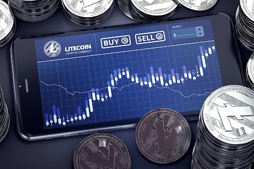 Smartphone with Litecoin trading chart on-screen among piles of silver Litecoins. Litecoin trading concept. 3D rendering