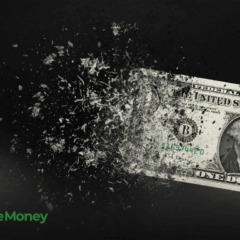 Nota de um dólar sendo deteriorada pela inflação.